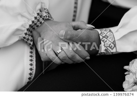 Close Up of Couple Holding Hands in Traditional Embroidered Clothing Black and White Photography Close Up of Couple Holding Hands in Traditional Embroidered Clothing Black and White Photography 139976874