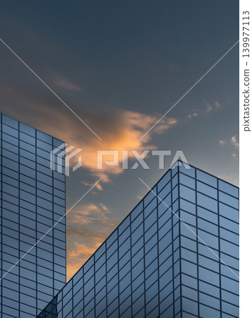 Modern Glass Buildings Against Sunset Sky Modern Glass Buildings Against Sunset Sky 139977113