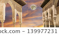Arches in Islamic (Moorish) style (against the sunset with the super moon) in Alhambra, Granada, Spain 139977231
