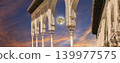 Arches in Islamic (Moorish) style (against the sunset with the super moon) in Alhambra, Granada, Spain 139977575
