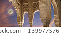 Arches in Islamic (Moorish) style (against the sunset with the super moon) in Alhambra, Granada, Spain 139977576