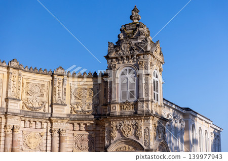 Ornate baroque facade featuring intricate stone reliefs, sculptural details Ornate baroque facade featuring intricate stone reliefs, sculptural details 139977943