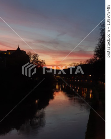 Vibrant sunset sky over Ill river in Strasbourg Vibrant sunset sky over Ill river in Strasbourg 139978488