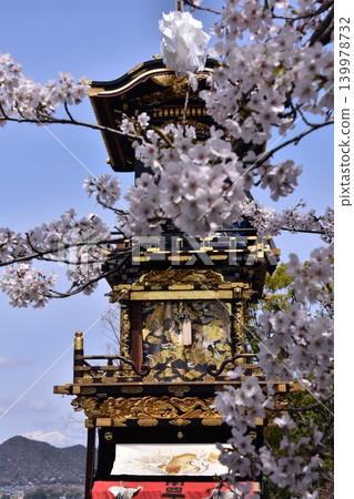 Inuyama City, Aichi Prefecture, Japan: Springtime Inuyama Festival and cherry blossoms in full bloom; floats gathered in front of Inuyama Castle Square; a scene before the dedication of the mechanical puppets. 139978732