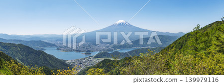 Lake Kawaguchi and Mount Fuji viewed from a mountain lush with new greenery. Lake Kawaguchi and Mount Fuji viewed from a mountain lush with new greenery. 139979116