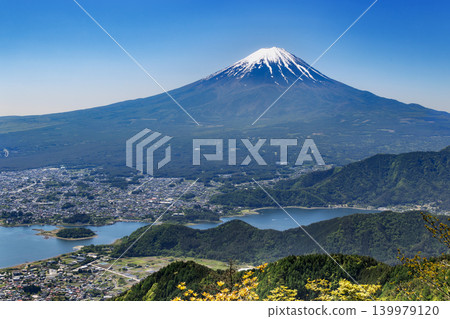 Lake Kawaguchi and Mount Fuji viewed from a mountain lush with new greenery. Lake Kawaguchi and Mount Fuji viewed from a mountain lush with new greenery. 139979120