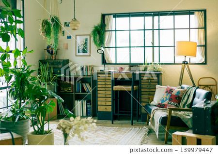 A room surrounded by houseplants with a desk. A room surrounded by houseplants with a desk. 139979447