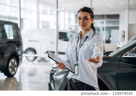 How can I help you conception. Successful automotive consultant standing near car interior 139979585