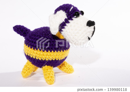 Knitted woolen dog on a white background Knitted woolen dog on a white background 139980118