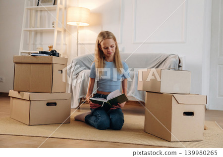 Young girl is moving into new home with her dog Young girl is moving into new home with her dog 139980265