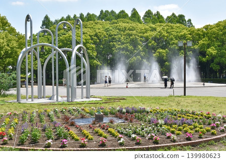 View of the large fountain at Shonai Green Park from the lawn area. View of the large fountain at Shonai Green Park from the lawn area. 139980623