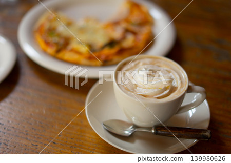 Viennese coffee and pizza on a wooden table Viennese coffee and pizza on a wooden table 139980626