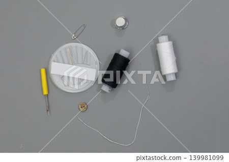 Sewing supplies are placed on a table ready for crafting. Sewing supplies are placed on a table ready for crafting. 139981099
