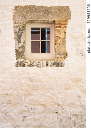 A small, light-colored window in a house of Piran, Slovenia A small, light-colored window in a house of Piran, Slovenia 139981396