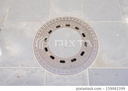 The manhole cover in Piran, Slovenia 139981399