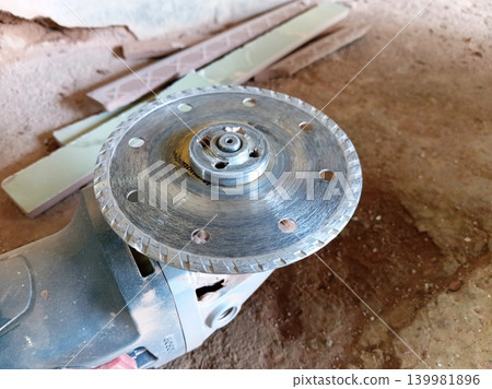 Close up of a grinder blade or saw blade for cutting ceramics. Close up of a grinder blade or saw blade for cutting ceramics. 139981896