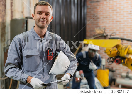 Portrait American Caucasian male worker happy smile working service machine in workshop with safety Portrait American Caucasian male worker happy smile working service machine in workshop with safety 139982127
