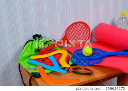 bright game sports equipment close up on a wooden table bright game sports equipment close up on a wooden table 139982272