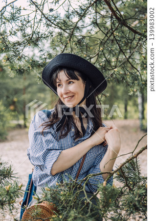Close up portrait of person experiencing emotional wellbeing and tranquility during spiritual nature connection in green woodland Close up portrait of person experiencing emotional wellbeing and tranquility during spiritual nature connection in green woodland 139983002