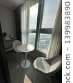 A comfortable sitting area, a beautiful view of the city 139983890