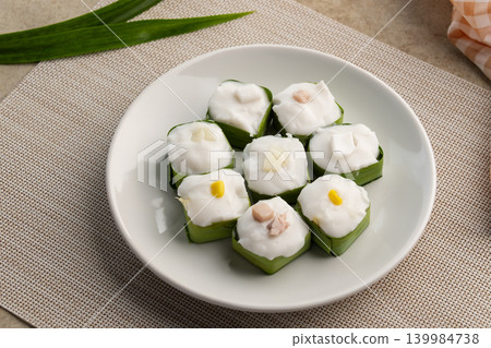 Thai pudding with coconut topping and corn,taro. Thai pudding with coconut topping and corn,taro. 139984738
