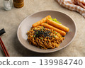 takoyaki flavors instant noodles topped with crisp seaweed and grilled chicken sausage  139984740
