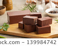 Sliced duck blood curd on wooden plate. 139984742