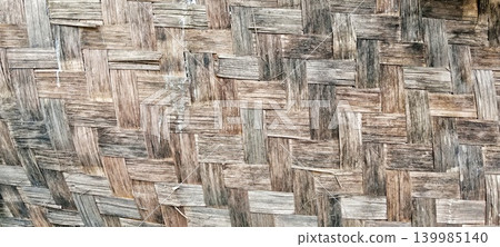 Old bamboo weaving pattern with natural brown color Old bamboo weaving pattern with natural brown color 139985140