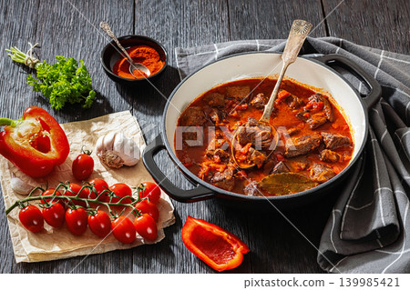 Beef goulash stew with paprika in ceramic pot 139985421