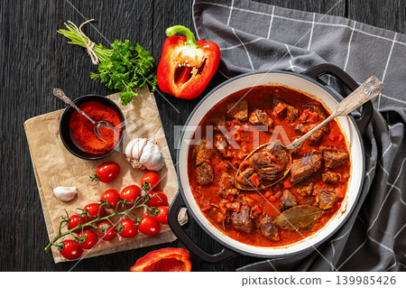 Beef goulash stew with paprika in ceramic pot Beef goulash stew with paprika in ceramic pot 139985426