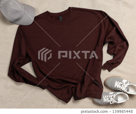 Blank brown unisex sweatshirt mockup, crewneck template flat lay with sneakers and baseball cap 139985448