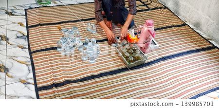 Serang, Banten, Indonesia, 05-27-2026, Arranging water glasses for guests Serang, Banten, Indonesia, 05-27-2026, Arranging water glasses for guests 139985701