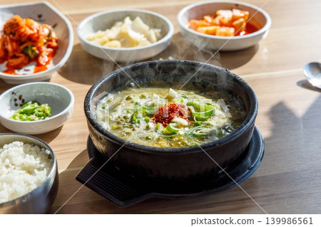 Traditional Jeju Pork and Seaweed Soup Momguk in Earthenware Pot Traditional Jeju Pork and Seaweed Soup Momguk in Earthenware Pot 139986561