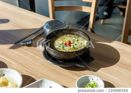 Traditional Jeju Pork and Seaweed Soup Momguk in Earthenware Pot Traditional Jeju Pork and Seaweed Soup Momguk in Earthenware Pot 139986568
