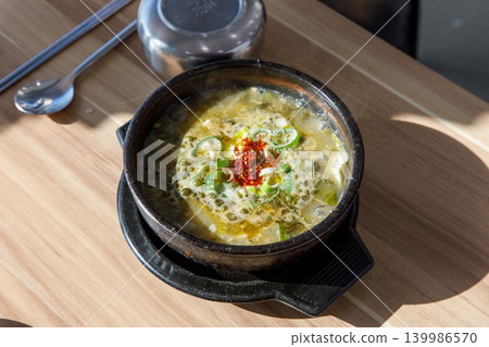 Traditional Jeju Pork and Seaweed Soup Momguk in Earthenware Pot Traditional Jeju Pork and Seaweed Soup Momguk in Earthenware Pot 139986570