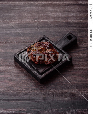 Beef mignon steak, rare, meat grilled with salt and spices. Beef steak Beef mignon steak, rare, meat grilled with salt and spices. Beef steak 139986721