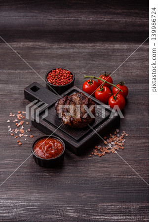 Beef mignon steak, rare, meat grilled with salt and spices. Beef steak Beef mignon steak, rare, meat grilled with salt and spices. Beef steak 139986724