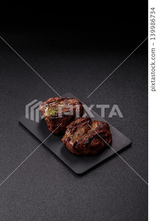 Beef mignon steak, rare, meat grilled with salt and spices. Beef steak Beef mignon steak, rare, meat grilled with salt and spices. Beef steak 139986734