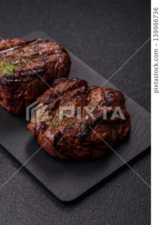 Beef mignon steak, rare, meat grilled with salt and spices. Beef steak Beef mignon steak, rare, meat grilled with salt and spices. Beef steak 139986736