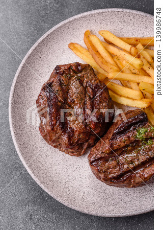 Beef mignon steak, rare, meat grilled with salt and spices. Beef steak 139986748