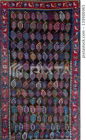 Authentic traditional Piradabil carpet from the Cuban group of Azerbaijan featuring intricate geometric ornaments, rich woven texture, and colorful ethnic Caucasian craftsmanship. Decorative oriental Authentic traditional Piradabil carpet from the Cuban group of Azerbaijan featuring intricate geometric ornaments, rich woven texture, and colorful ethnic Caucasian craftsmanship. Decorative oriental 139986965