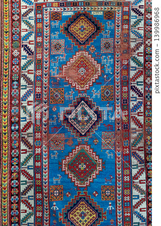Authentic traditional Gachagan carpet from the Kazakh group of Georgia featuring bold geometric ornaments, rich woven texture, and colorful Caucasian ethnic craftsmanship. Decorative oriental rug Authentic traditional Gachagan carpet from the Kazakh group of Georgia featuring bold geometric ornaments, rich woven texture, and colorful Caucasian ethnic craftsmanship. Decorative oriental rug 139986968
