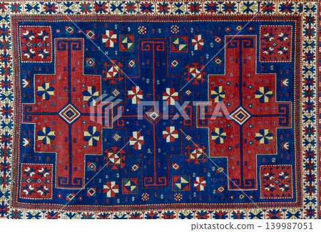 Authentic traditional Derbent carpet in Cuban style from Dagestan featuring intricate geometric ornaments, rich woven texture, and ethnic Caucasian craftsmanship. Decorative oriental rug background Authentic traditional Derbent carpet in Cuban style from Dagestan featuring intricate geometric ornaments, rich woven texture, and ethnic Caucasian craftsmanship. Decorative oriental rug background 139987051