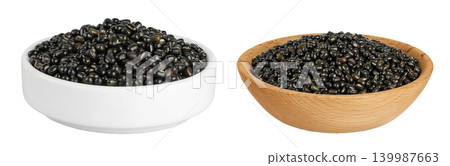 Black bean or Urad dal, black gram, vigna mungo in ceramic and wooden bowl isolated on the white background Black bean or Urad dal, black gram, vigna mungo in ceramic and wooden bowl isolated on the white background 139987663
