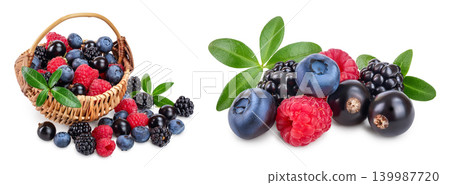 mix of blackberry blueberry raspberry black currant with leaf in wicker basket isolated on white background. 139987720