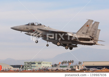Japan Air Self-Defense Force F-15DJ Eagles taking off in formation. Japan Air Self-Defense Force F-15DJ Eagles taking off in formation. 139987836