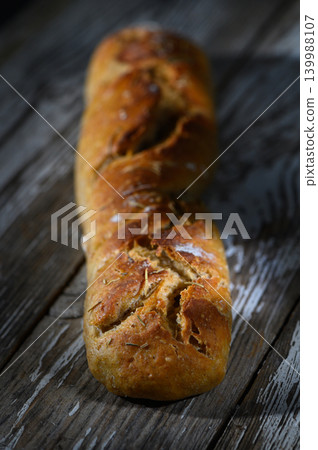 Artisan bread baked to perfection with a golden crust and rustic charm Artisan bread baked to perfection with a golden crust and rustic charm 139988107