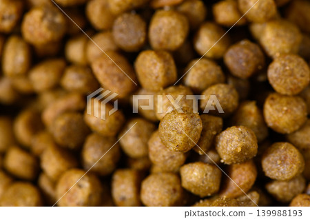 Crunchy and nourishing pet food pellets ready to energize your furry companions Crunchy and nourishing pet food pellets ready to energize your furry companions 139988193