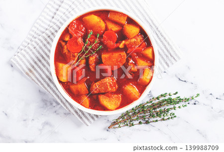 meat goulash with potatoes and carrots, sweet peppers, in a saucepan, top view, traditional Hungarian soup, homemade, no people, meat goulash with potatoes and carrots, sweet peppers, in a saucepan, top view, traditional Hungarian soup, homemade, no people, 139988709