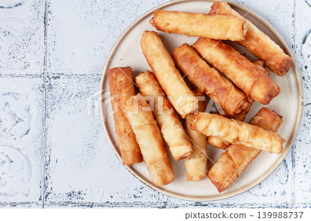 fried spring rolls with cheese, on a plate, with cream sauce, no people, fried spring rolls with cheese, on a plate, with cream sauce, no people, 139988737